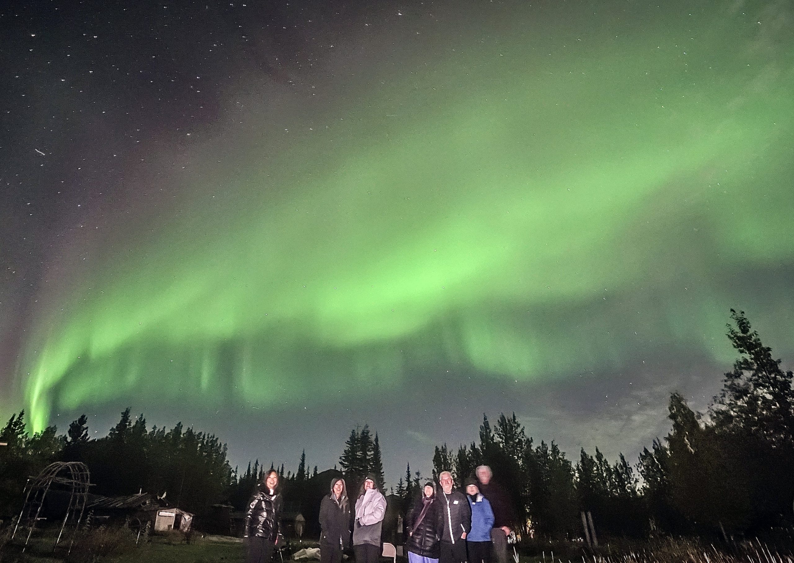 Wild Alaska Travel group watching northern lights in Wiseman.